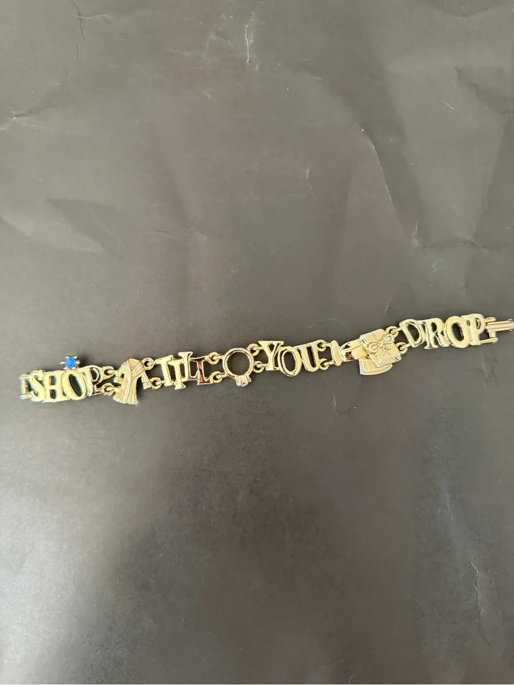 Gold Tone 'Shop Til You Drop' Charm Bracelet